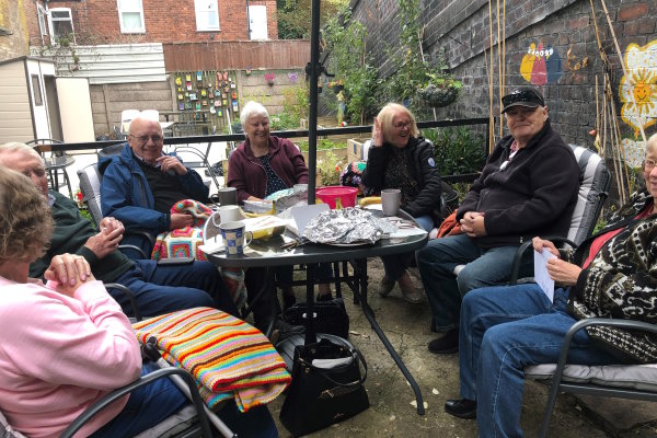 A group of people sat round a table at the Connect Youth and Community Centre